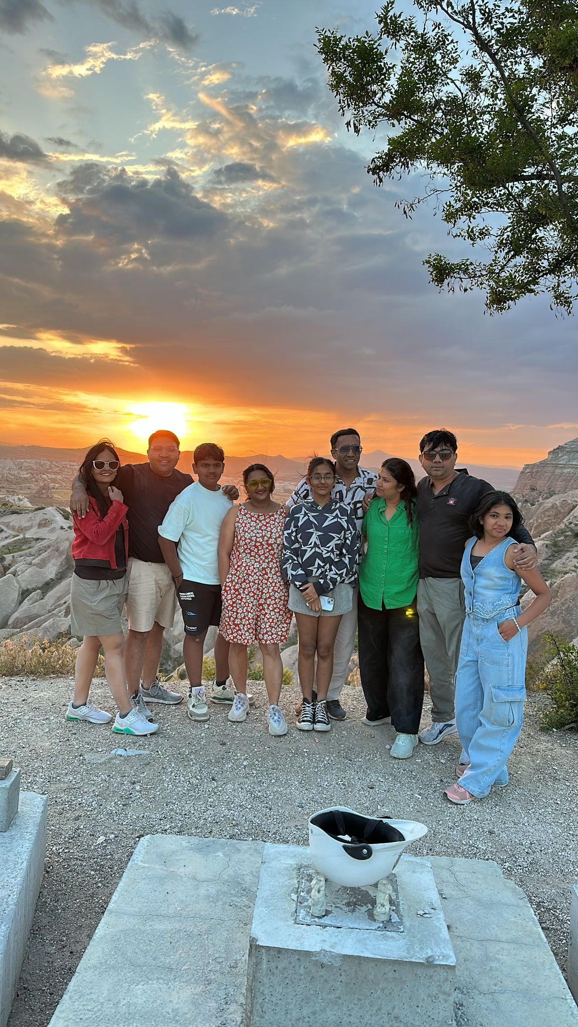 Travelers watching the sunset over the Cappadocia valleys