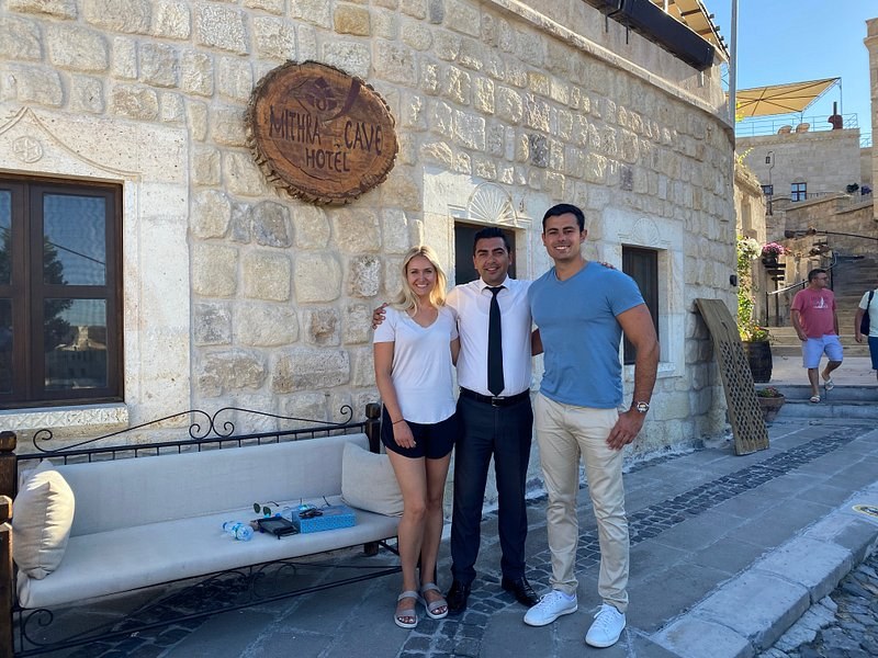 Guests arriving at a Cappadocia cave hotel in Göreme, the kind of stay travelers arrange around a confirmed sunrise balloon flight